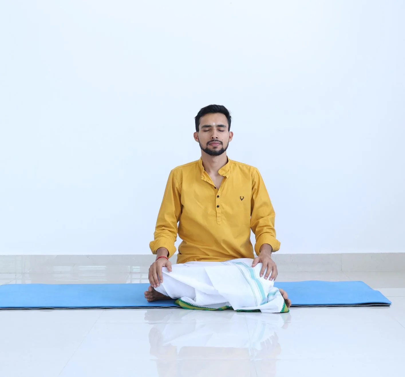 Abhi Nautiyal seated in meditation