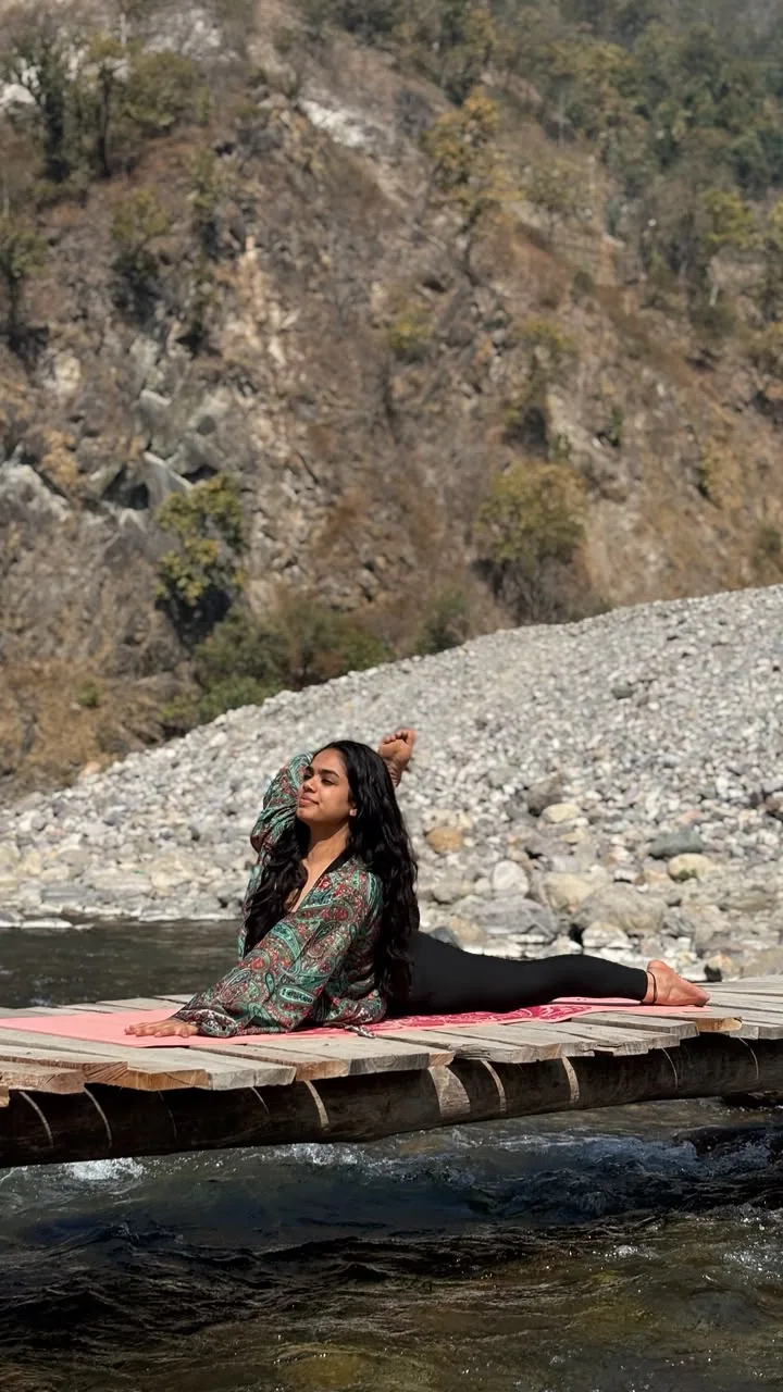 Portrait of Saloni Chauhan during her riverside yoga practice
