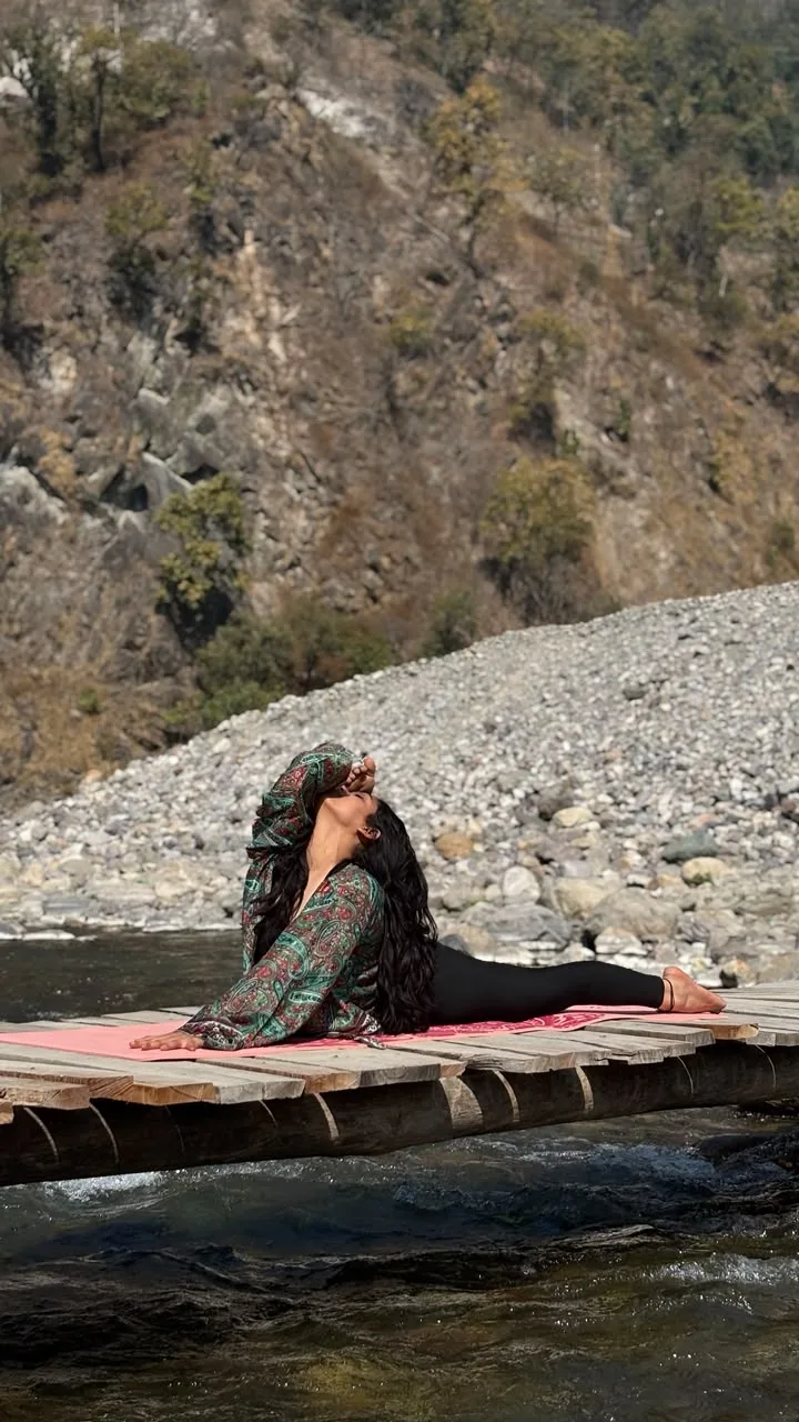Saloni Chauhan in a deep riverside yoga pose